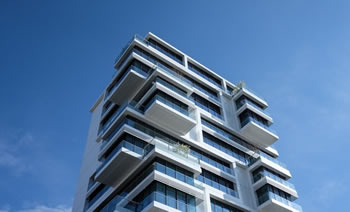 a commercial building under a blue sky