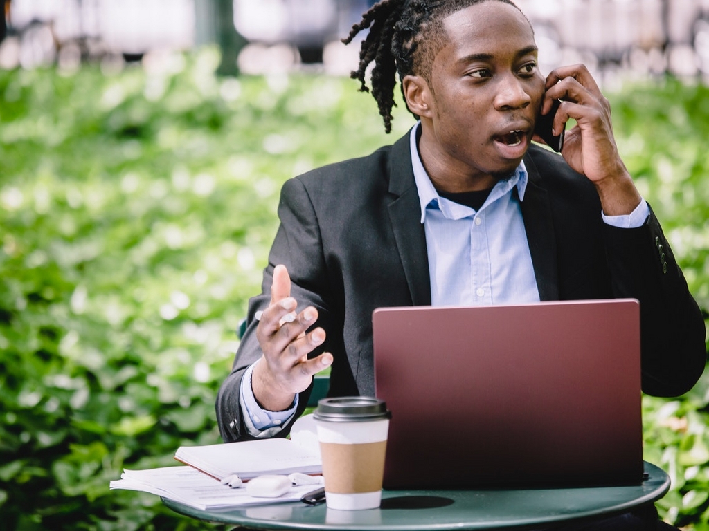 A man talking on the phone about becoming a commercial landlord