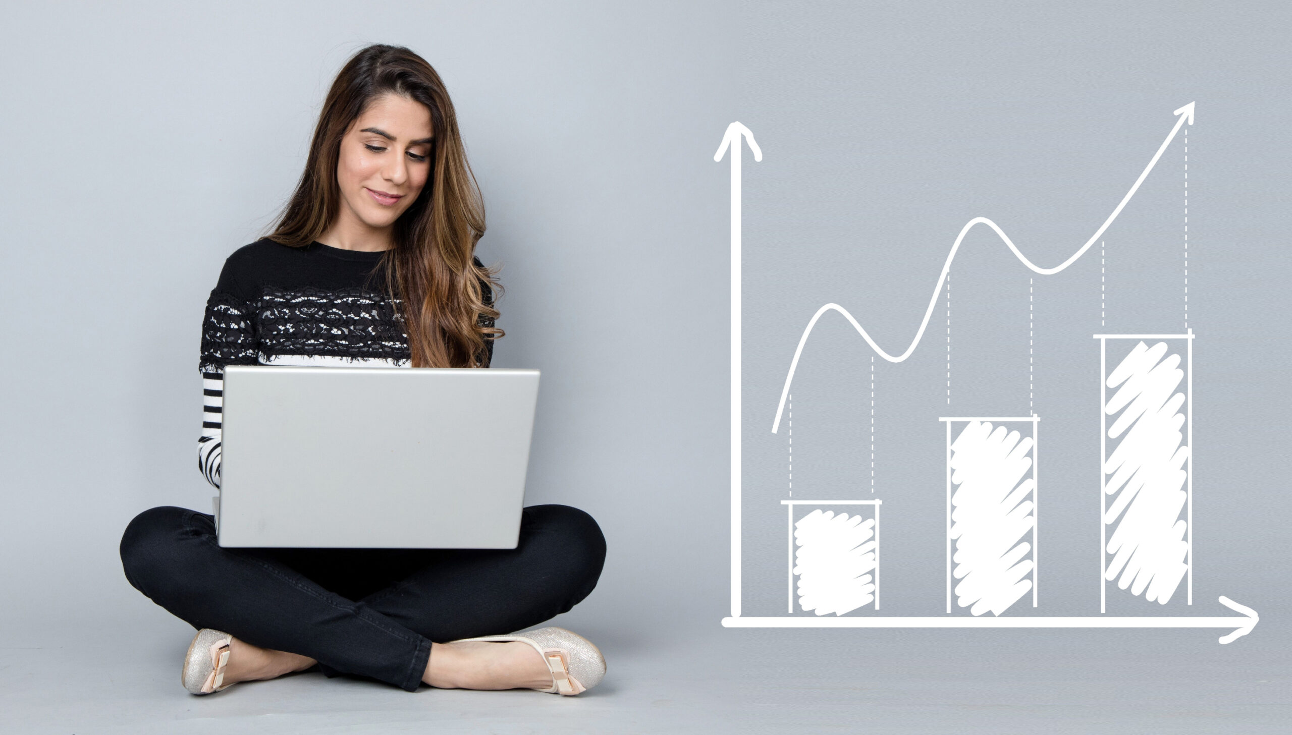 A businessperson going over profit charts that show the benefits of investing in commercial real estate during a recession